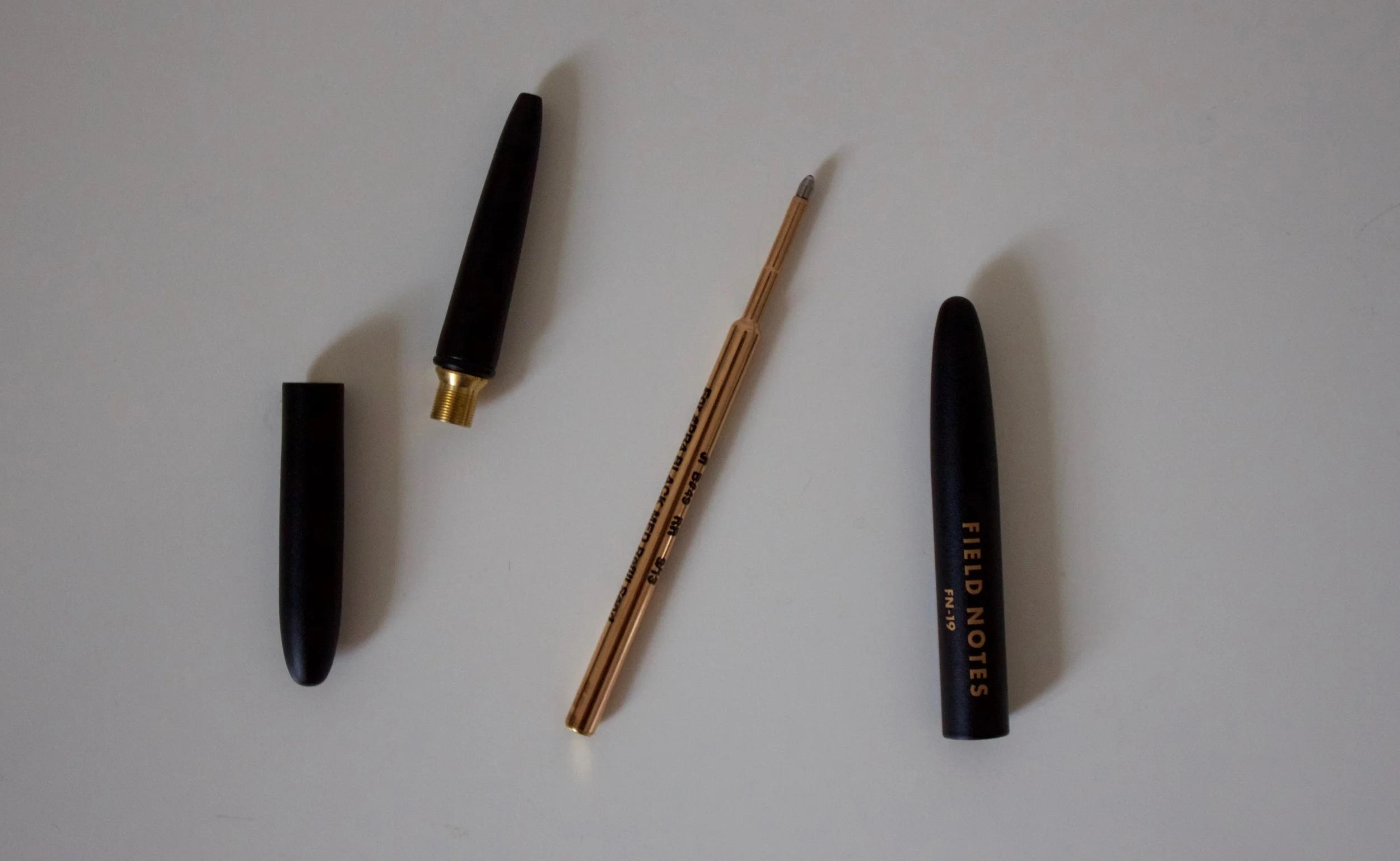 All of the component parts of the space pen