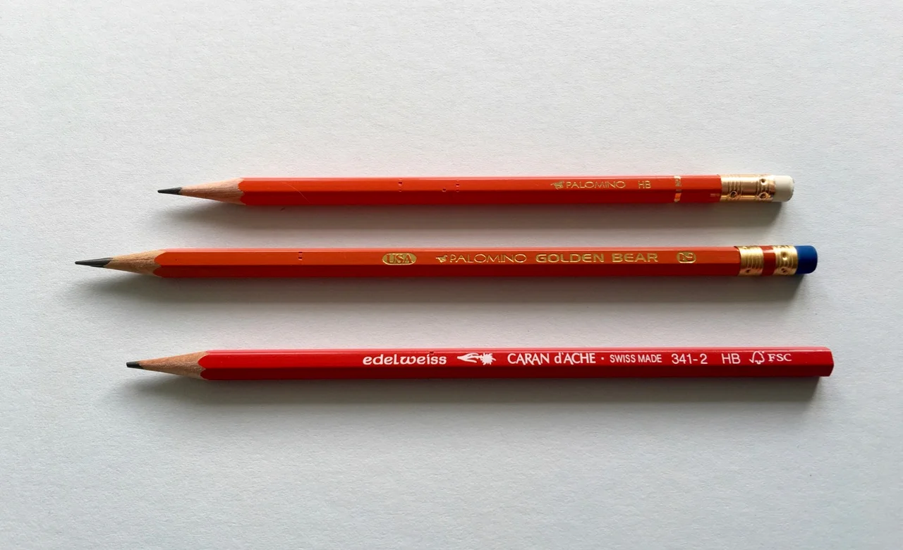 The Palomino HB pencil next to the Golden Bear and a Caran d'Ache, for redness comparison purposes 