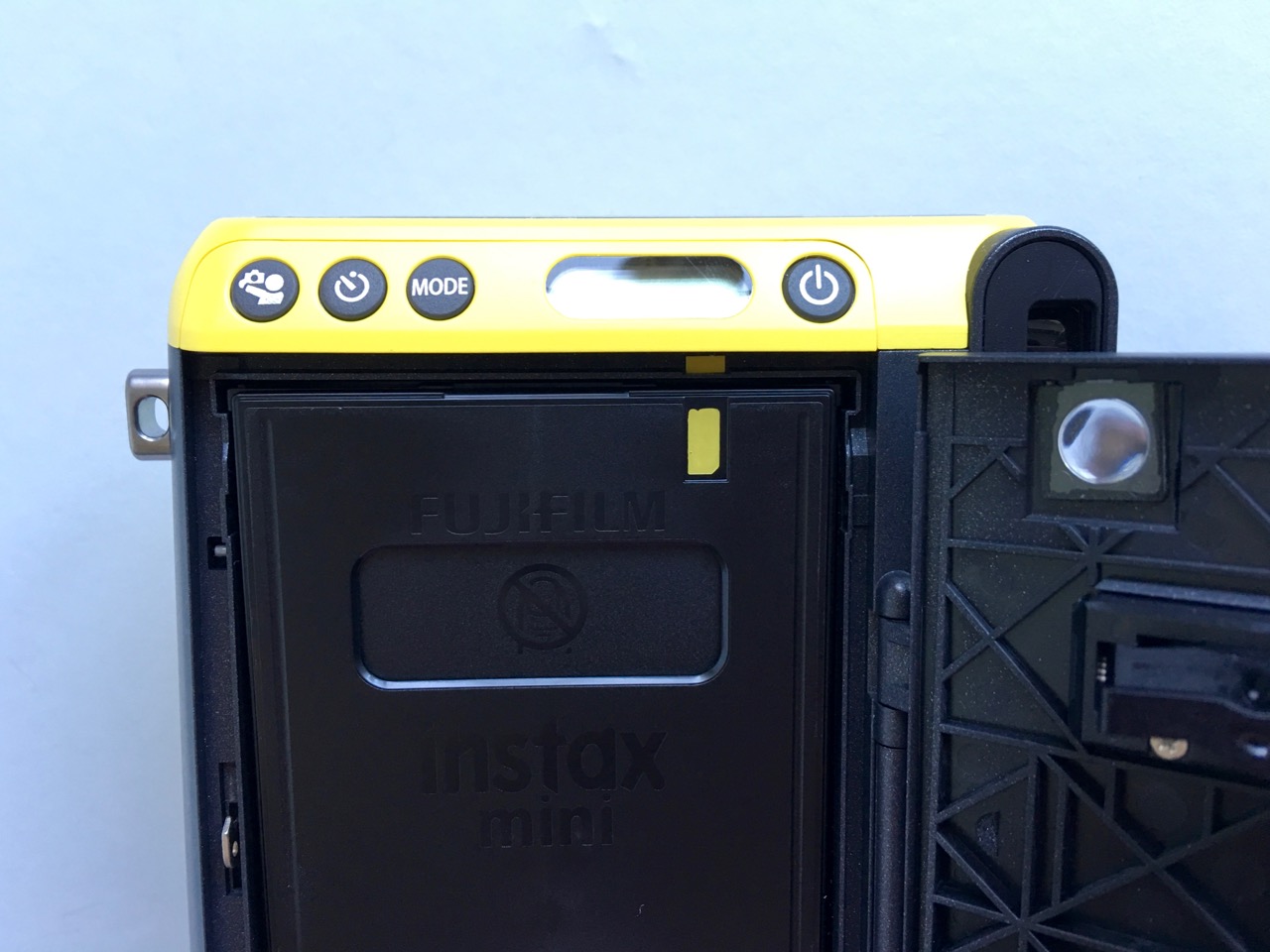 Film cartridge with helpful yellow guides to assist with correct loading
