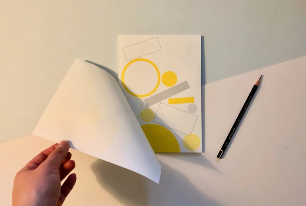Glue binding along the left hand, long side of the notepad