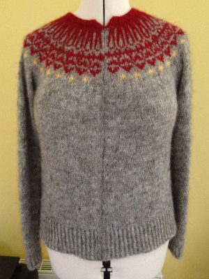 My sweater, washed and blocked with a single purl stitch running up the length of the sweater