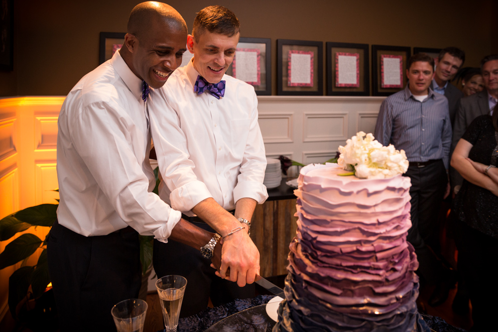 Couple cutting wedding cake