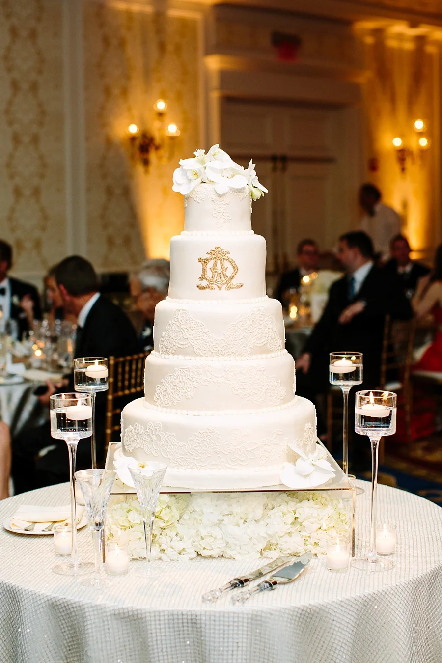 All white wedding cake with gold monogram | Edible Art Bakery of Raleigh