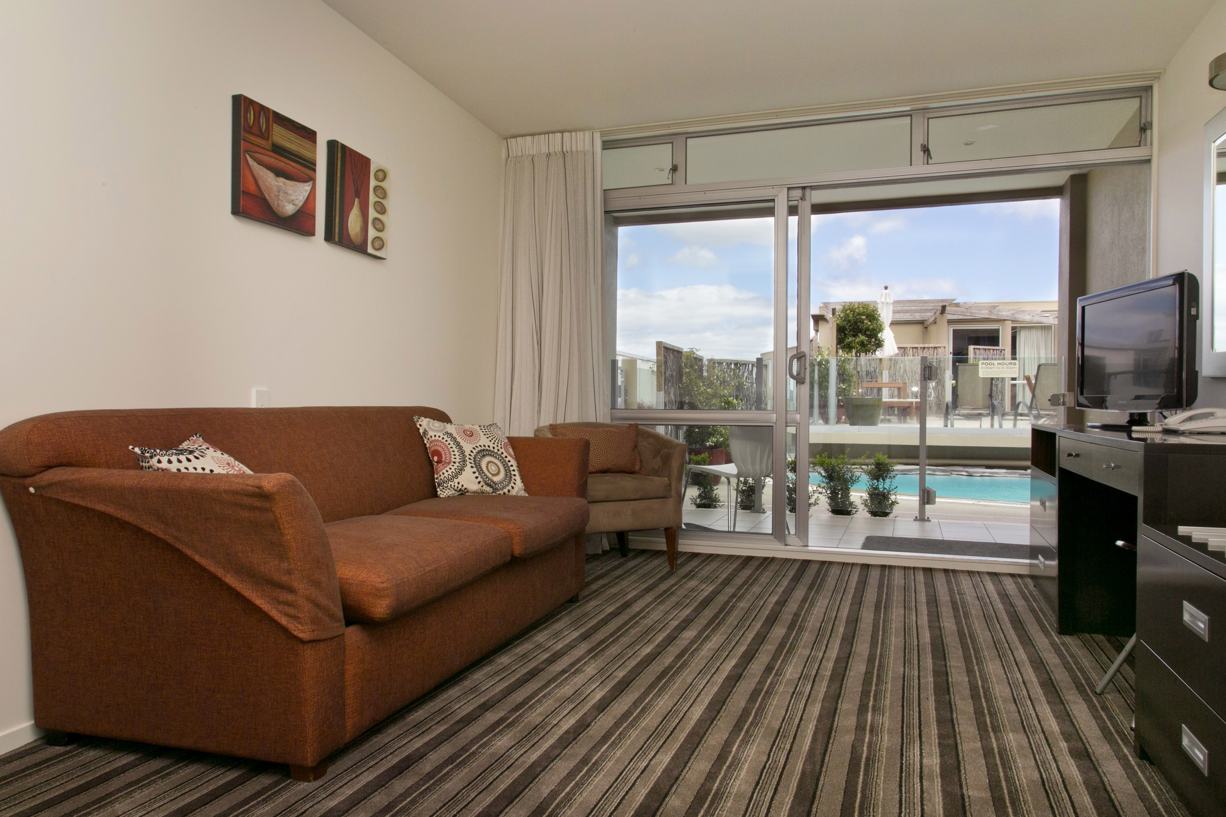 one bedroom poolside lounge towards pool area.jpg