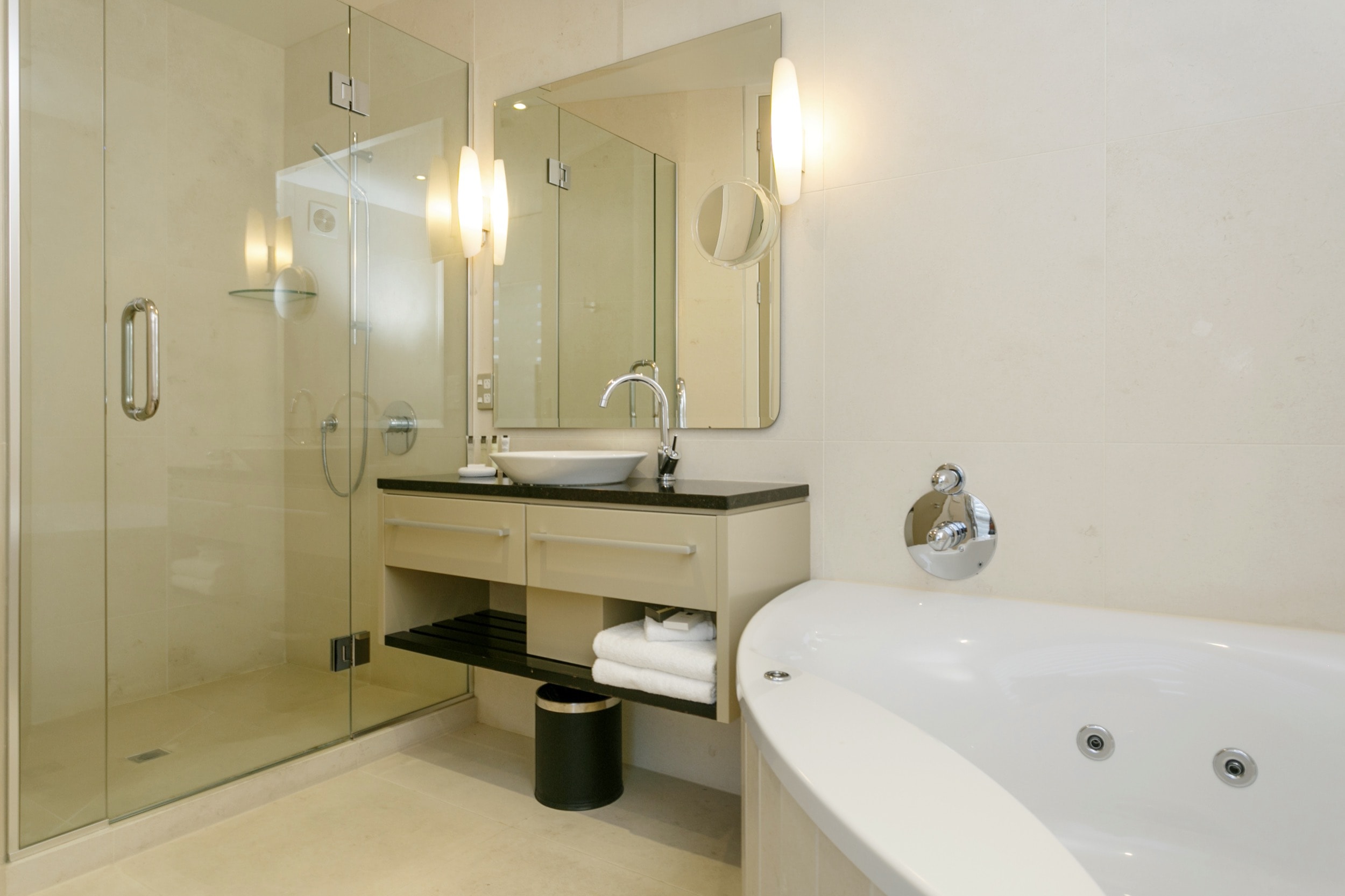 Ground floor two bedroom apartment master bedroom ensuite bathroom with spa bath 1.jpg