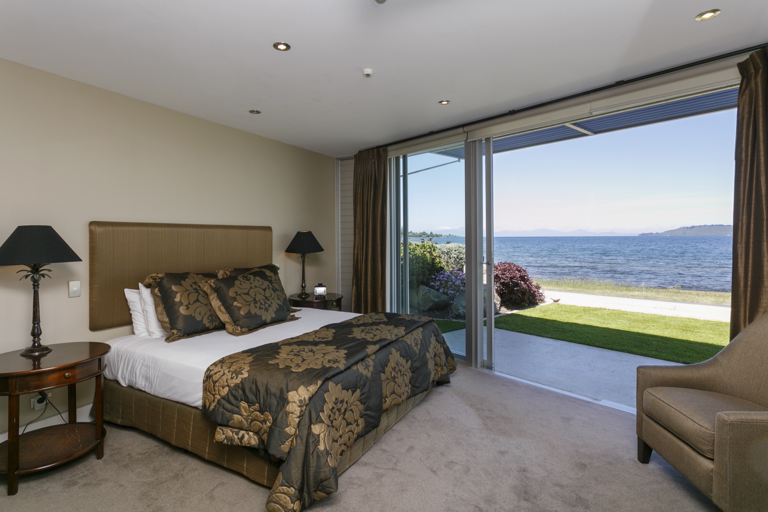 Ground floor two bedroom apartment master bedroom looking out onto lakefront view.jpg