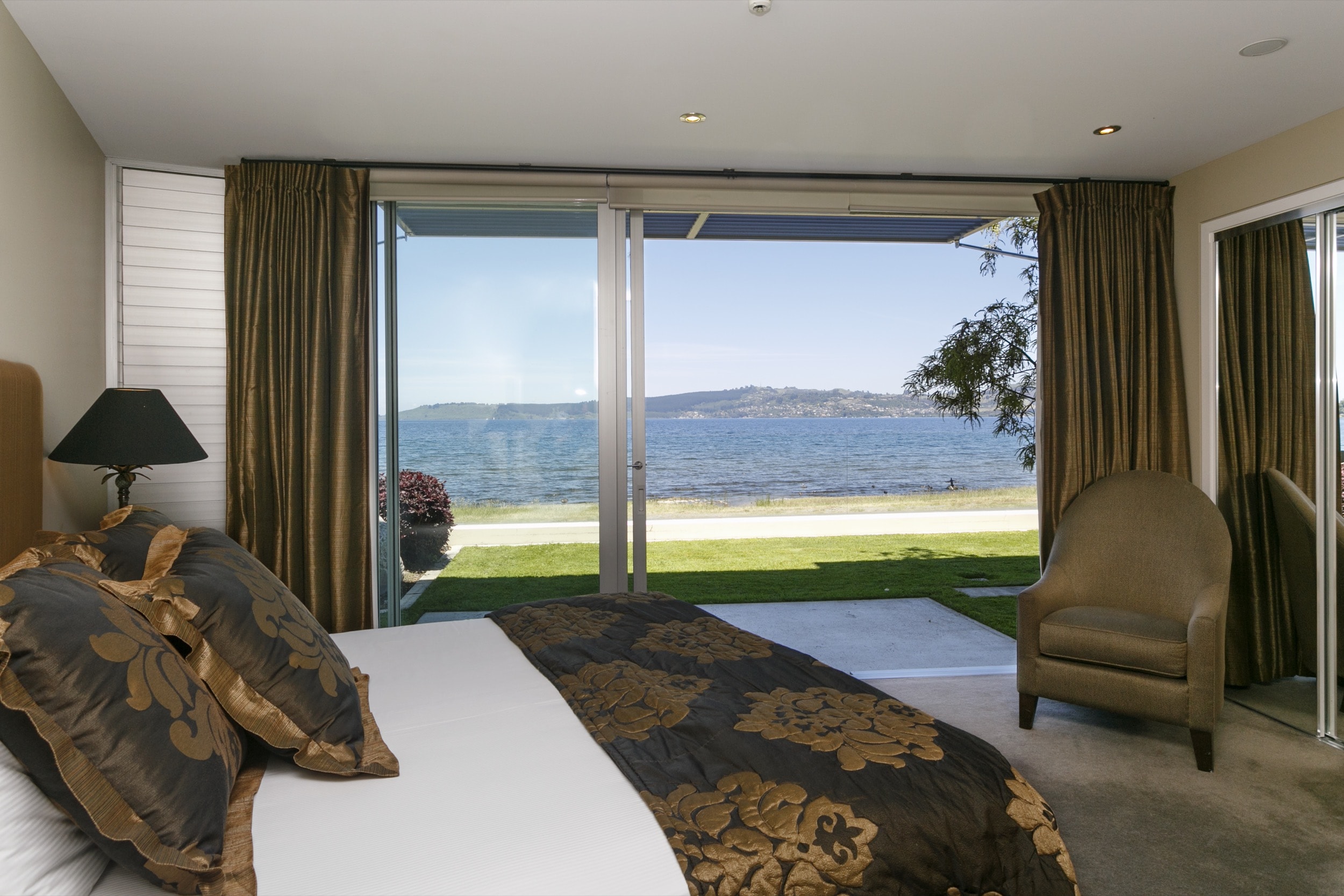 Ground floor two bedroom apartment master bedroom lookingout onto lake front.jpg