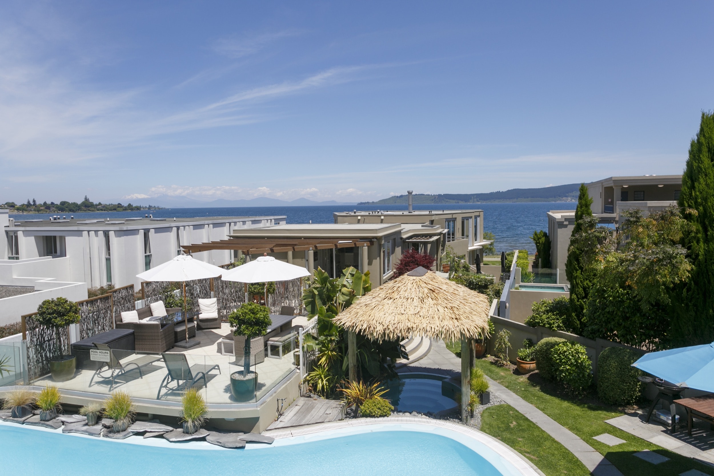 Luxury Studio with Lake Views view from balcony of pool area and lake Taupo and mountains -min.jpg