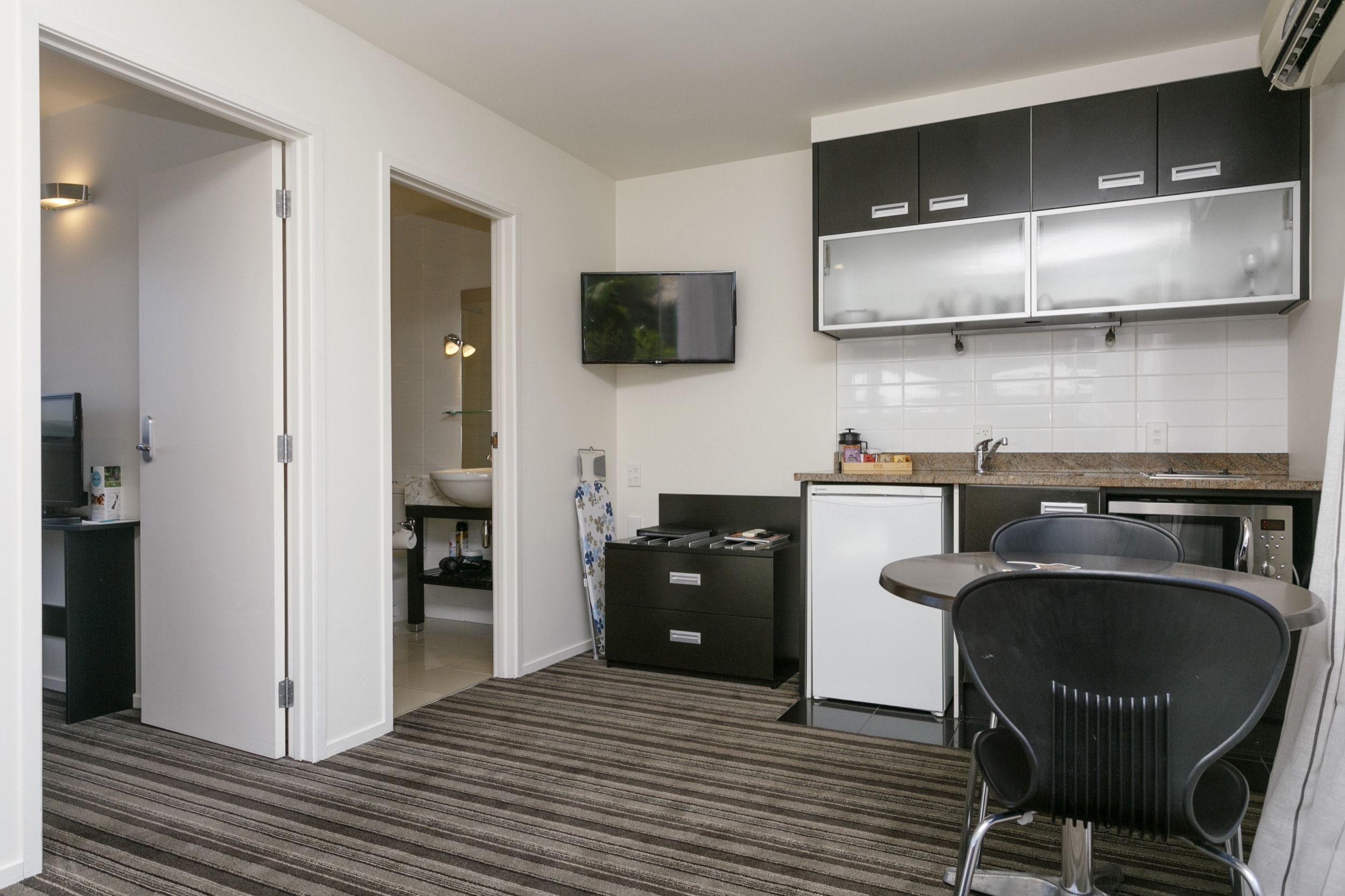 One Bedroom Gardev View living area lookig at kitchenette showing doors to bedroom and bathroom-min.jpg