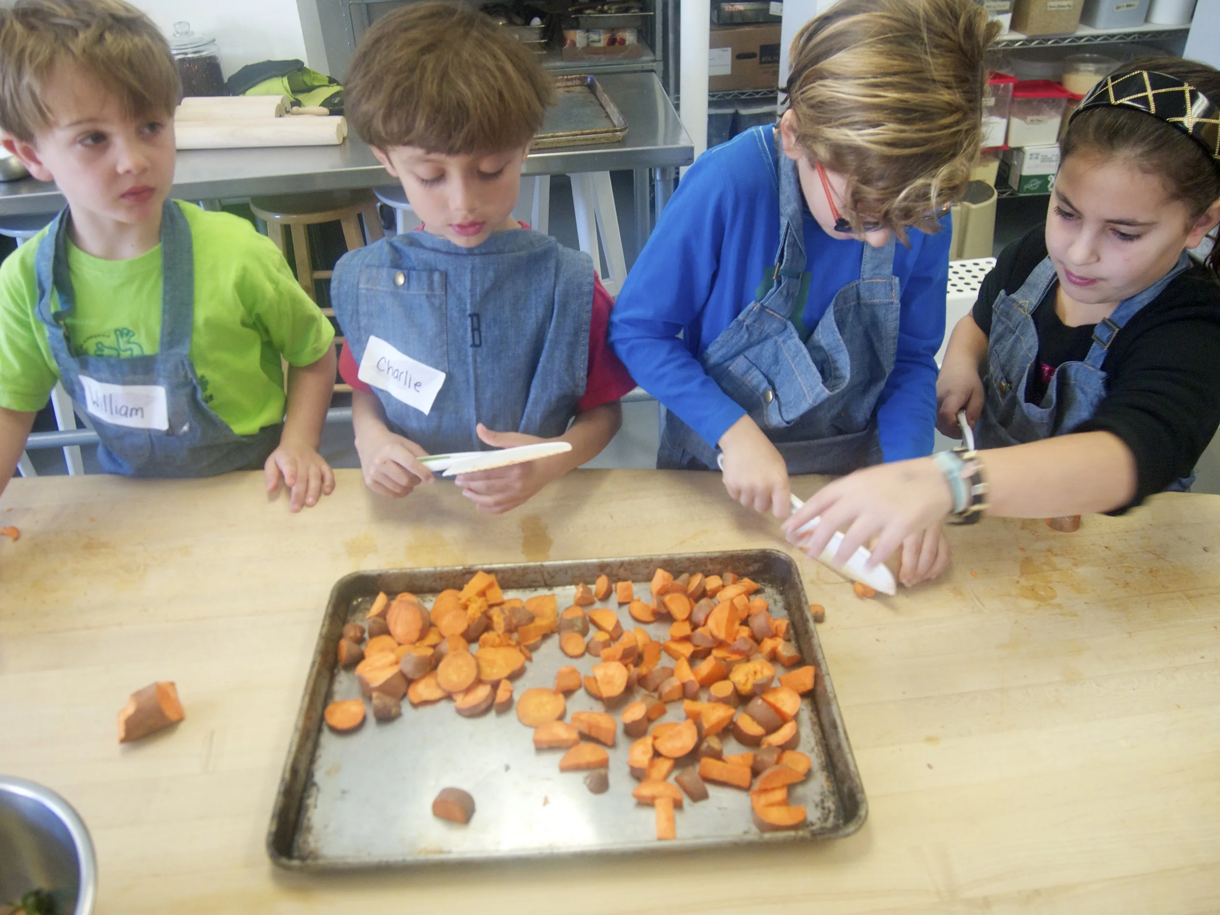Cutting up sweet potatoes to be roasted for our quesadillas!