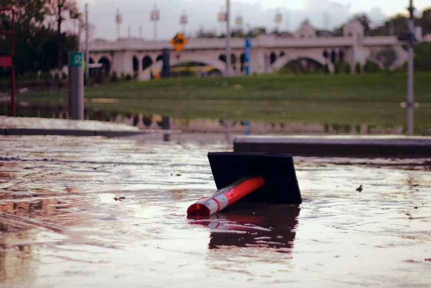 pylon lying down on flooded street.jpg