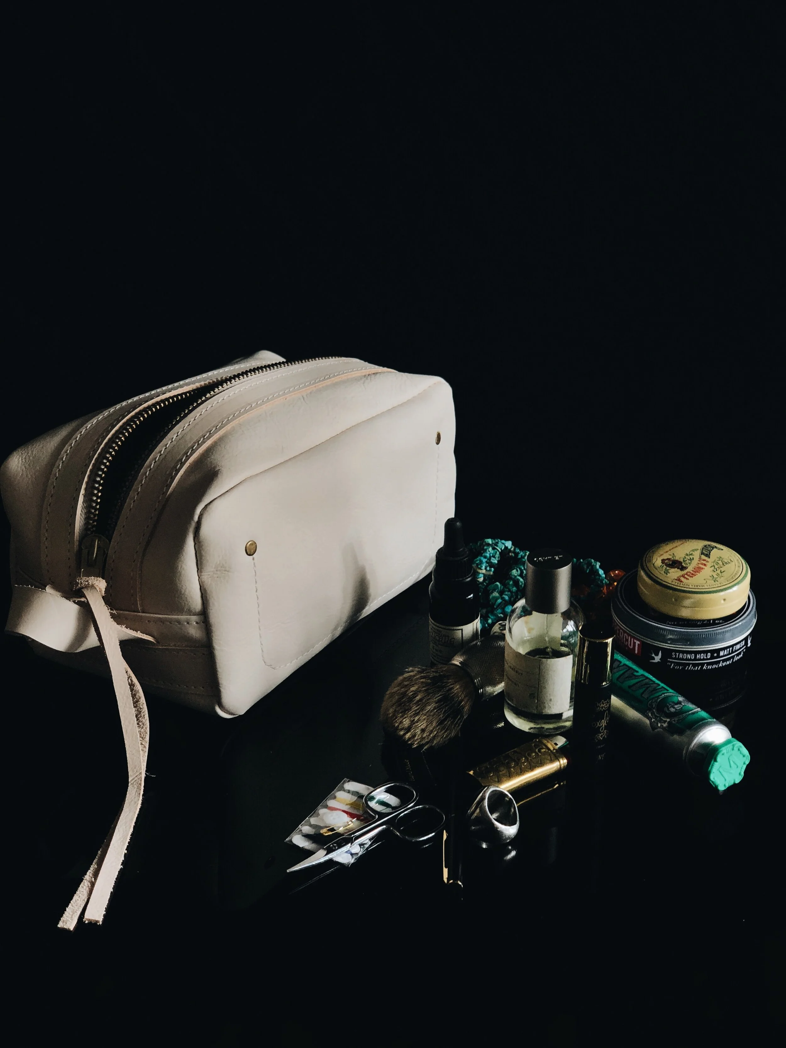 THE POGLIA CARRY ON LEATHER CASE  100% vegetable-tanned  leather that will age and create a patina over time. The YKK rustproof zipper is made from solid brass for reinforcement.