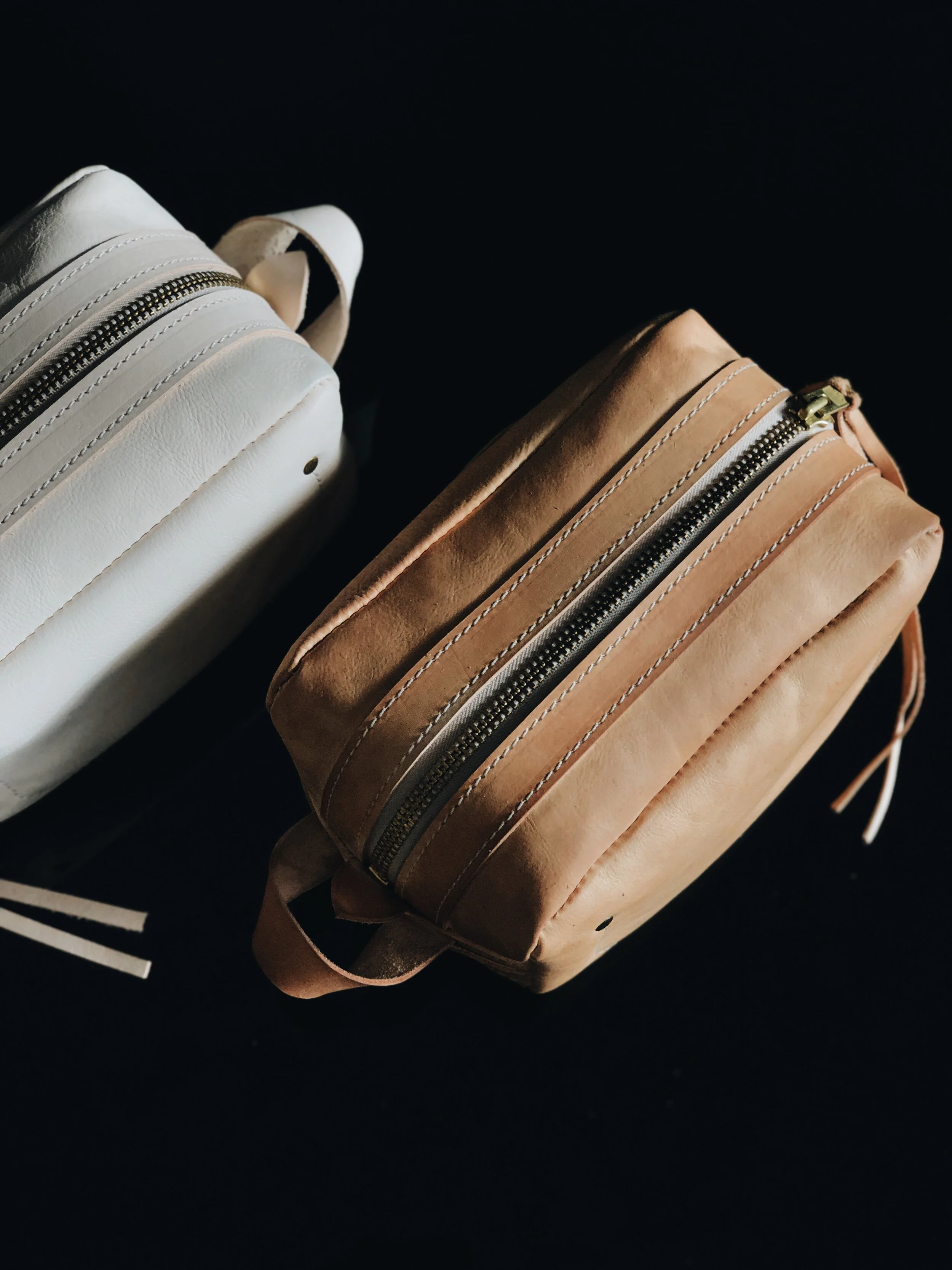 THE POGLIA CARRY ON LEATHER CASE  100% vegetable-tanned  leather that will age and create a patina over time. The YKK rustproof zipper is made from solid brass for reinforcement.