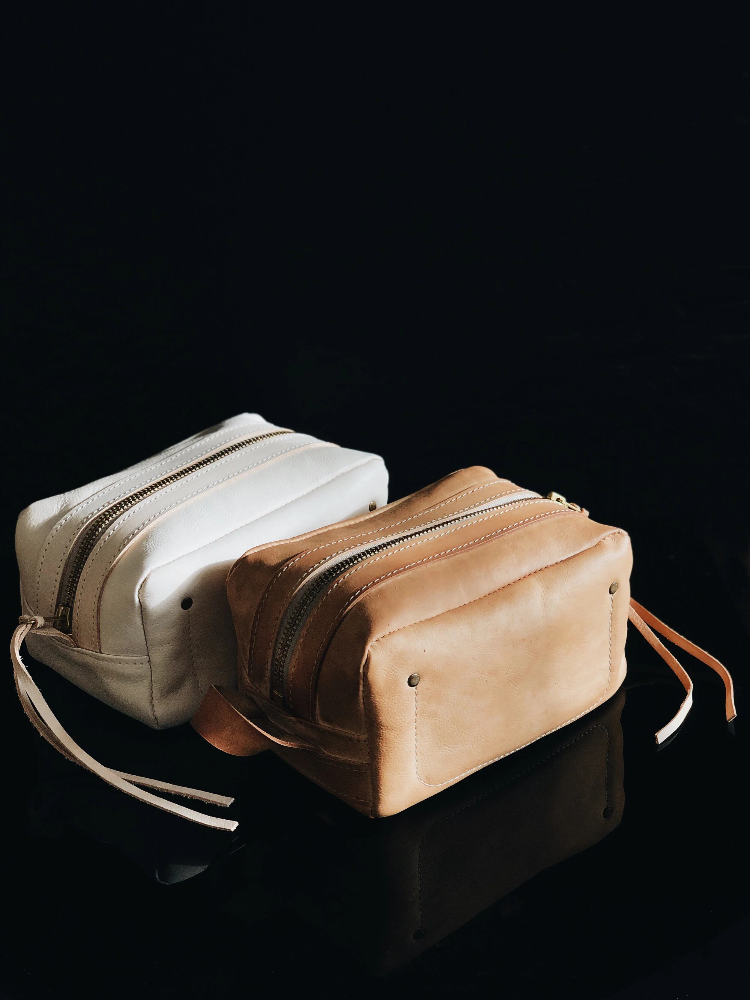 THE POGLIA CARRY ON LEATHER CASE  100% vegetable-tanned  leather that will age and create a patina over time. The YKK rustproof zipper is made from solid brass for reinforcement.
