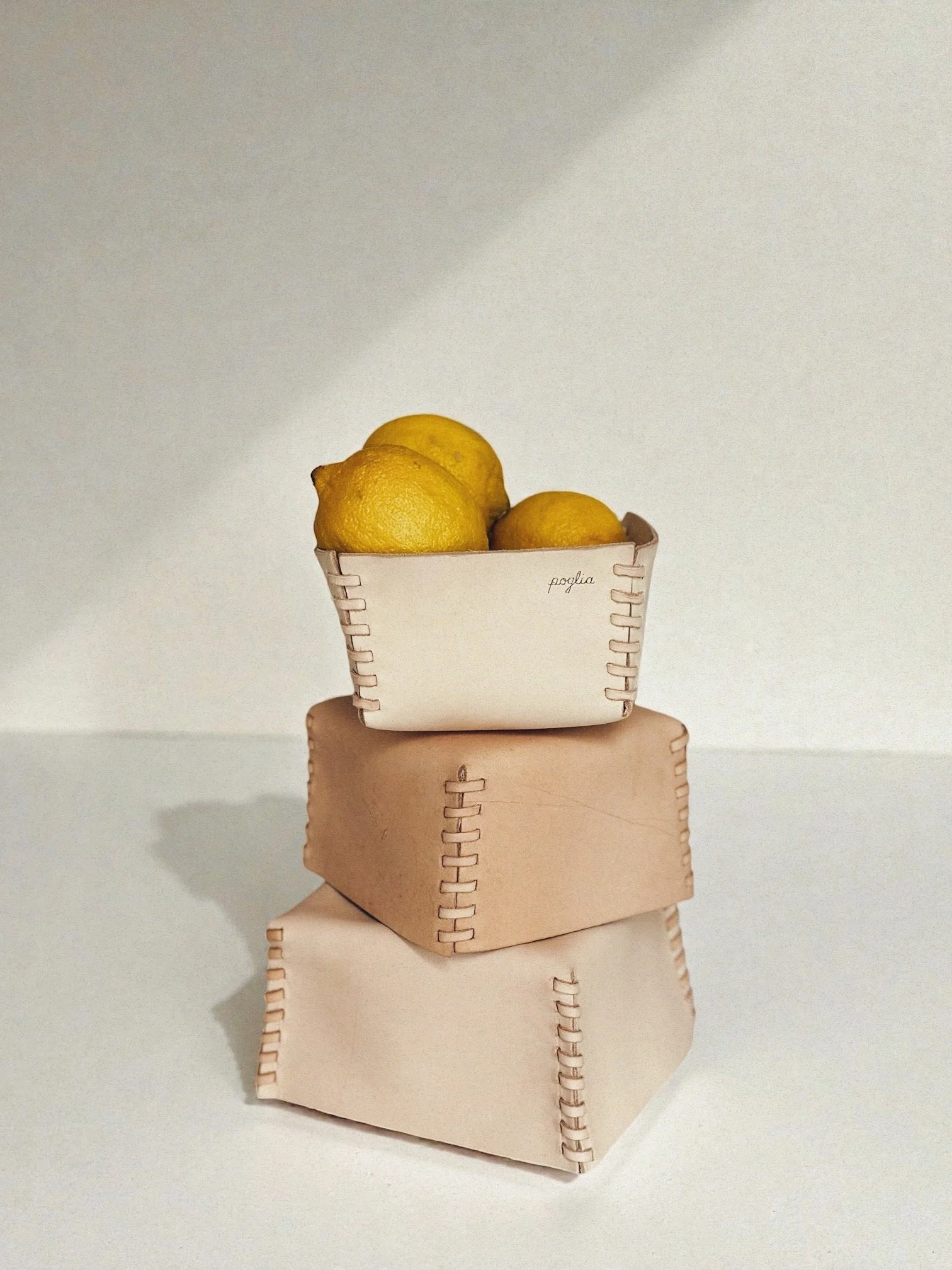 A set of three hand-stitched leather baskets 3.JPG