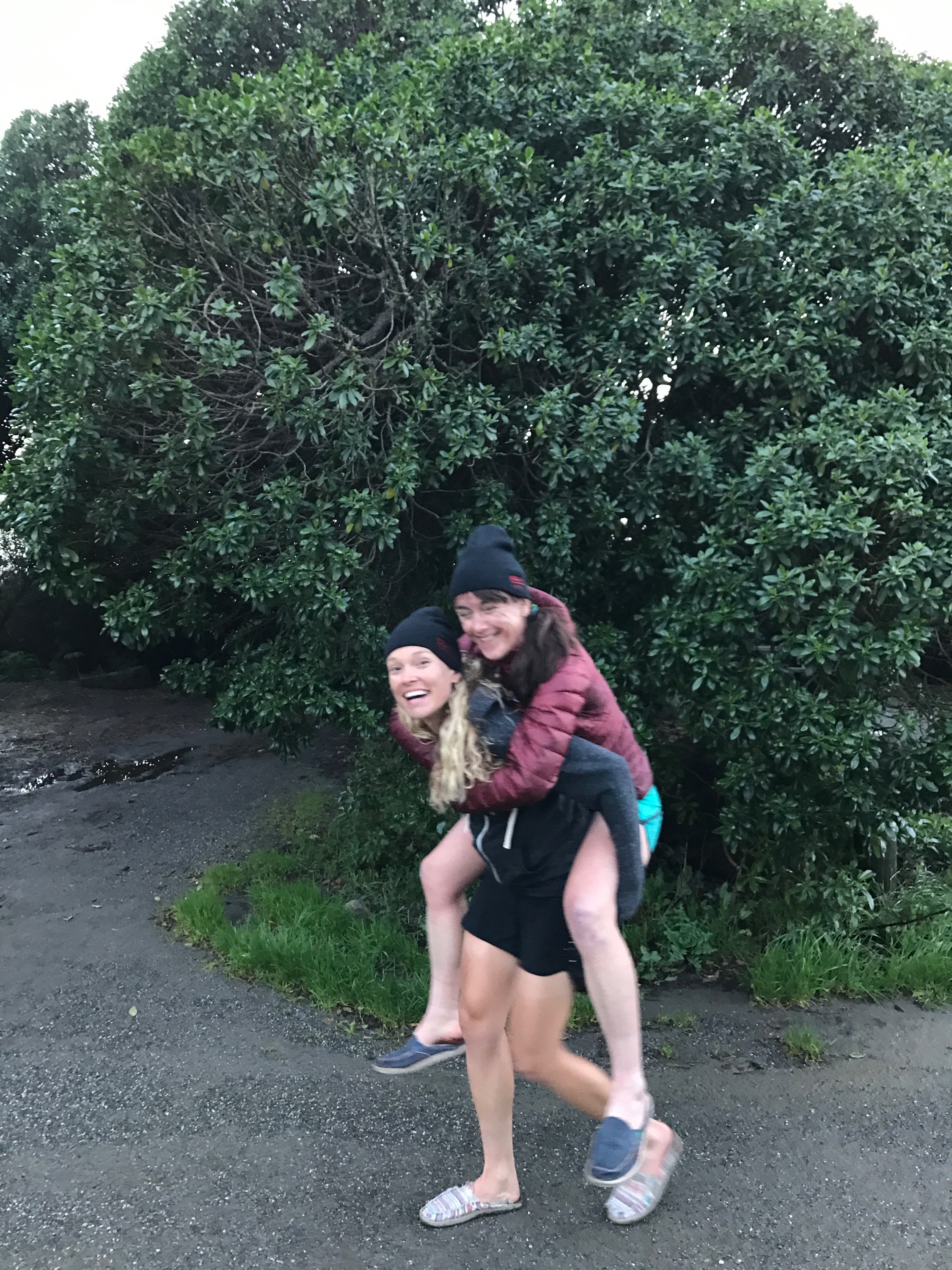A good wife carries her wife back from the beach when her feet hurt! :) (After 100 miles ride, I get added points!)