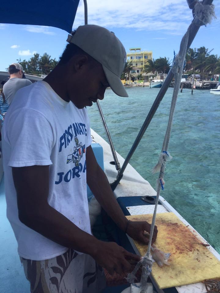 Cleaning and prepping fish on a moving boat... very impressed
