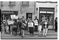 Sinn Fein Protest, Downpatrick, against shooting death of PIRA man Colm Marks by the RUC, 1990s. Bobbie Hanvey, photographer. Image bh011750, Bobbie Hanvey Photographic Archives, John J. Burns Library, Boston College. This image is part of a series of images found at: hdl.handle.net/2345/1926