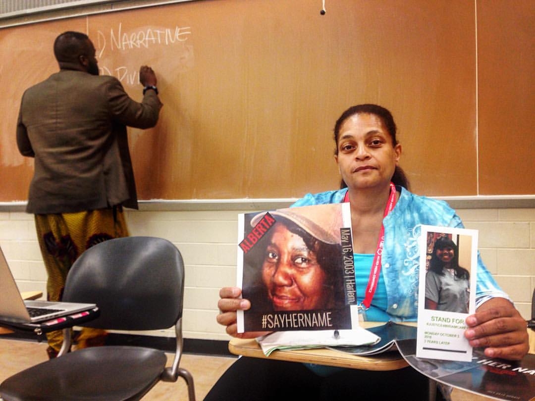 Cynthia Howell holding up her aunt's picture, police murder victim Alberta Spruill, with Allen of BLM-NY/Movement Lab writing on the board for our Police Brutality workshop series, "When GoFundMe Doesn't Cut It" and the Forced Trajectory Project screening.