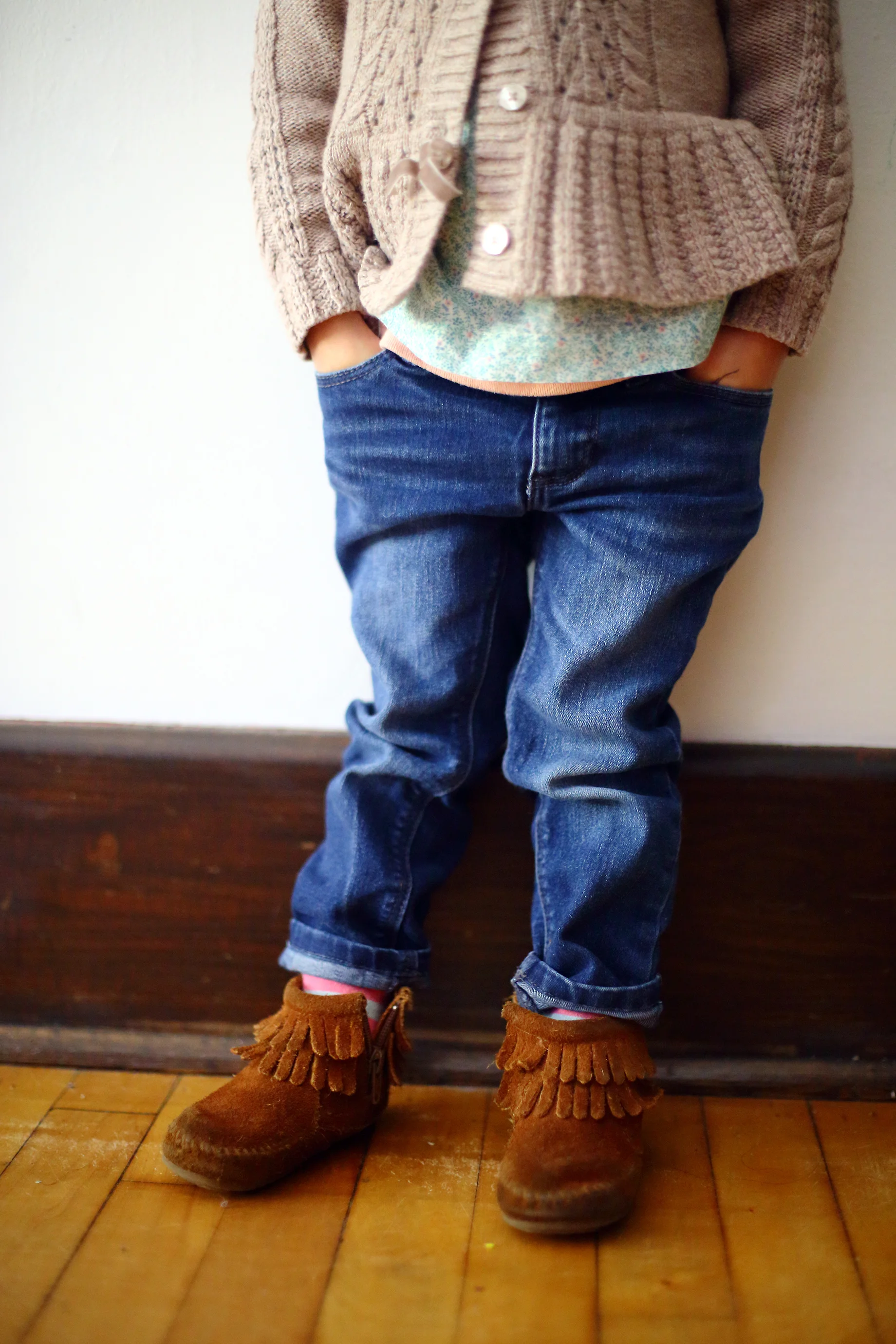 I just love the way she puts her hands in her pockets and they way she insists on layering her clothes