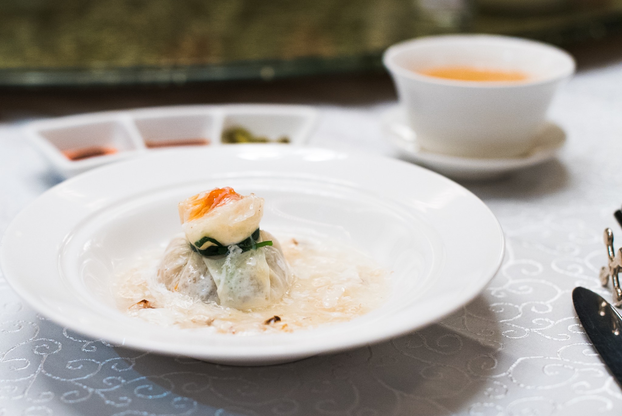 Steamed Seafood Dumpling with Egg White Sauce (蟹肉扒石榴球)