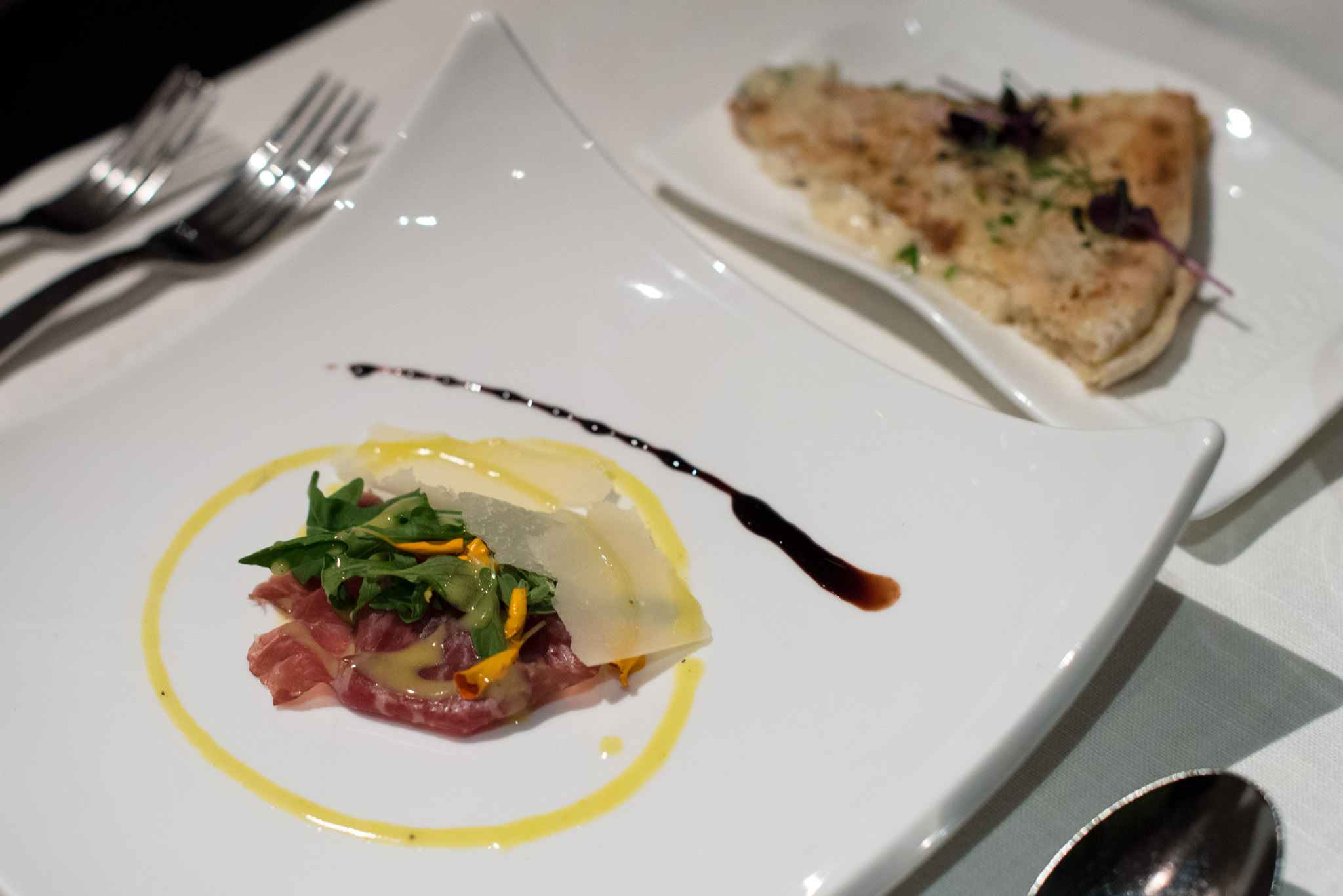 Front: 60-day Cured Wagyu Beef with 40-month Aged Parmesan Cheese and Summer Salad with Amalfi Lemon Dressing (S$31++) | Back:&nbsp;Focaccia MascarponeBasilico - Regent Singapore