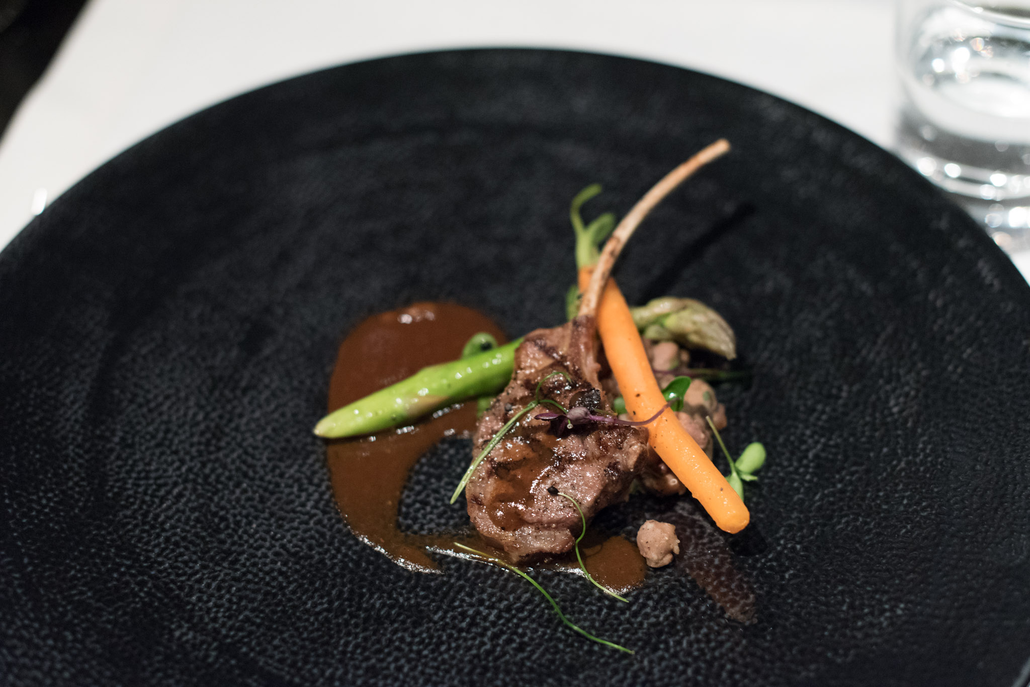 Thyme-roasted Rack of Lamb, Braised Leeks and Legume Ragout drizzled with Barbera Wine and Star Anise Sauce (S$38++) Basilico - Regent Singapore