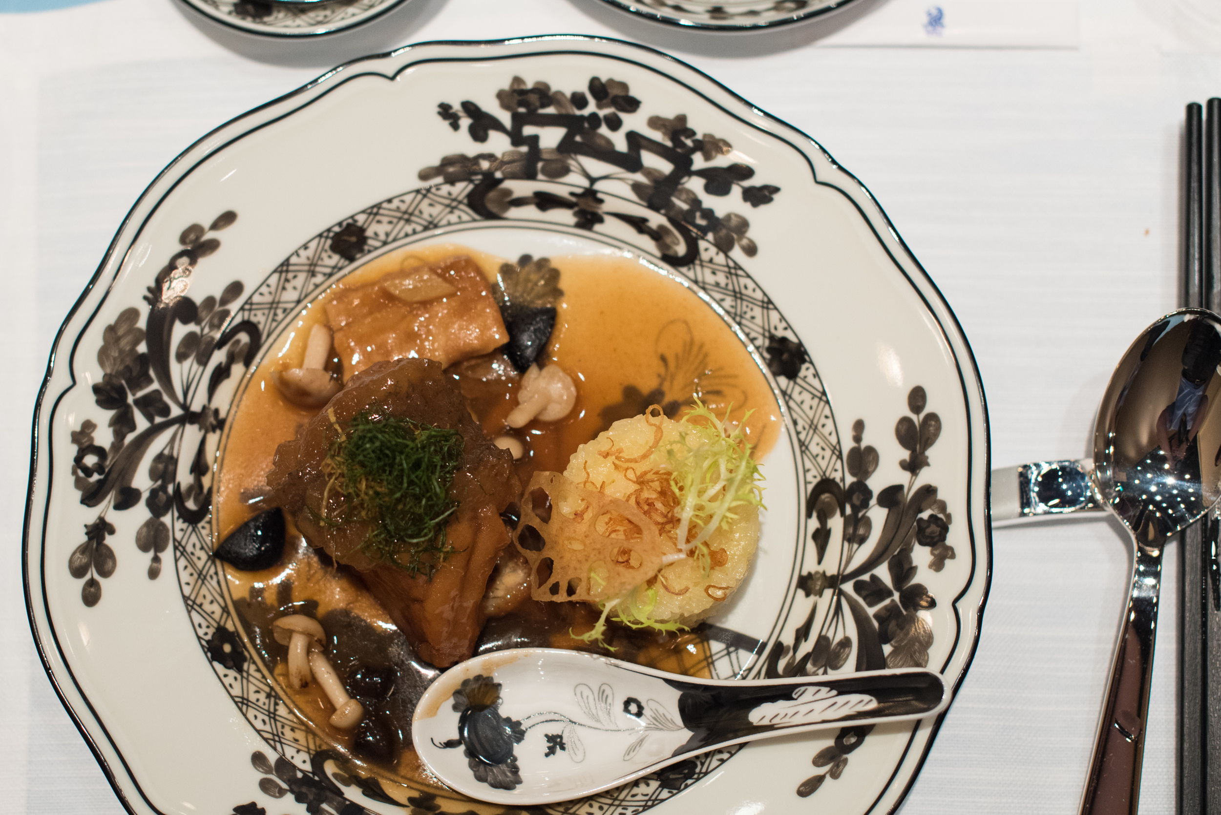 Braised Estuary Grouper, Dried Beancurd Skin, Mushroom, Organic Black Garlic, Steamed Glutinous Rice, Spring OnionSummer Pavilion - The Ritz-Carlton, Millenia Singapore