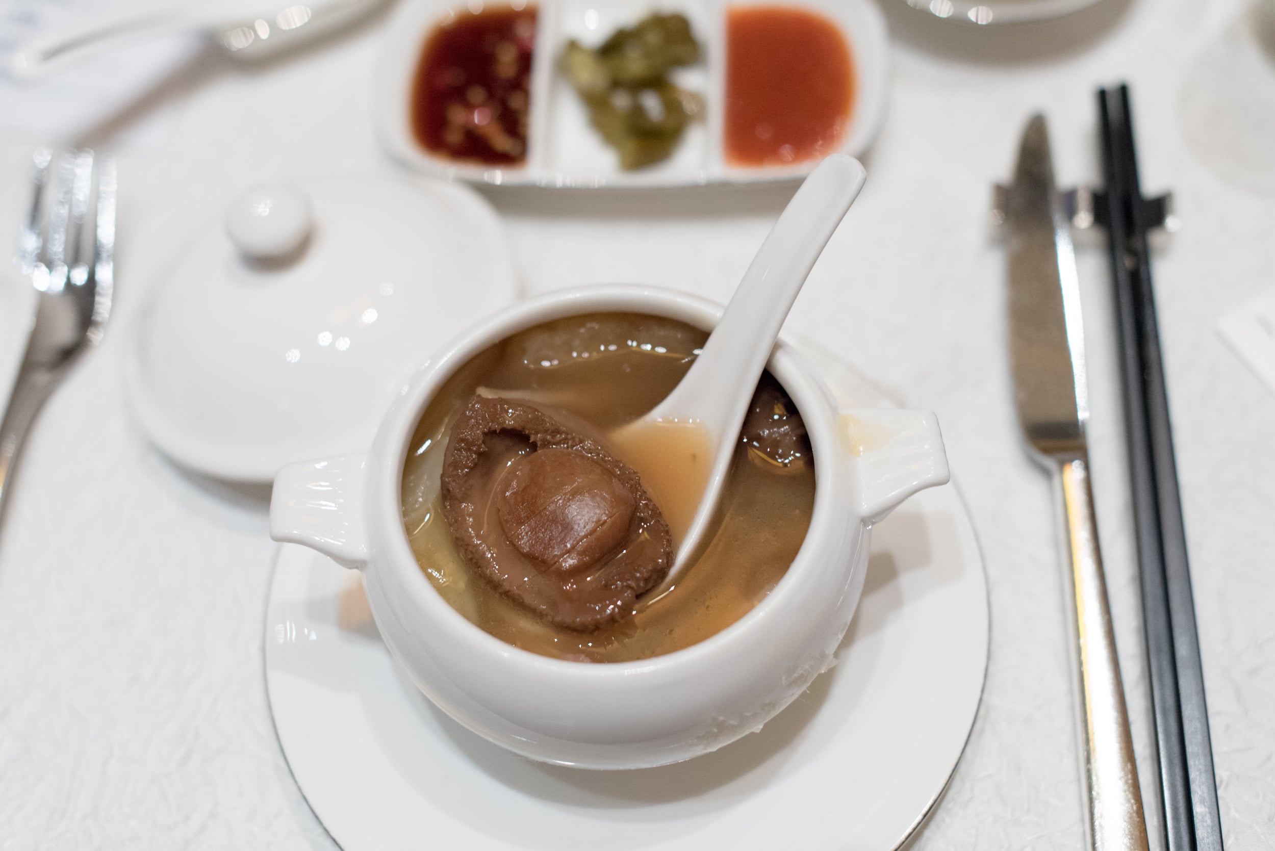 Braised Six-head Whole Abalone, Fish Maw, Sea Cucumber, Deep-fried Fish Maw, Chinese Cabbage, Flower Mushrooms, Roasted Garlic and Roasted Pork in ClaypotJade - The Fullerton Hotel