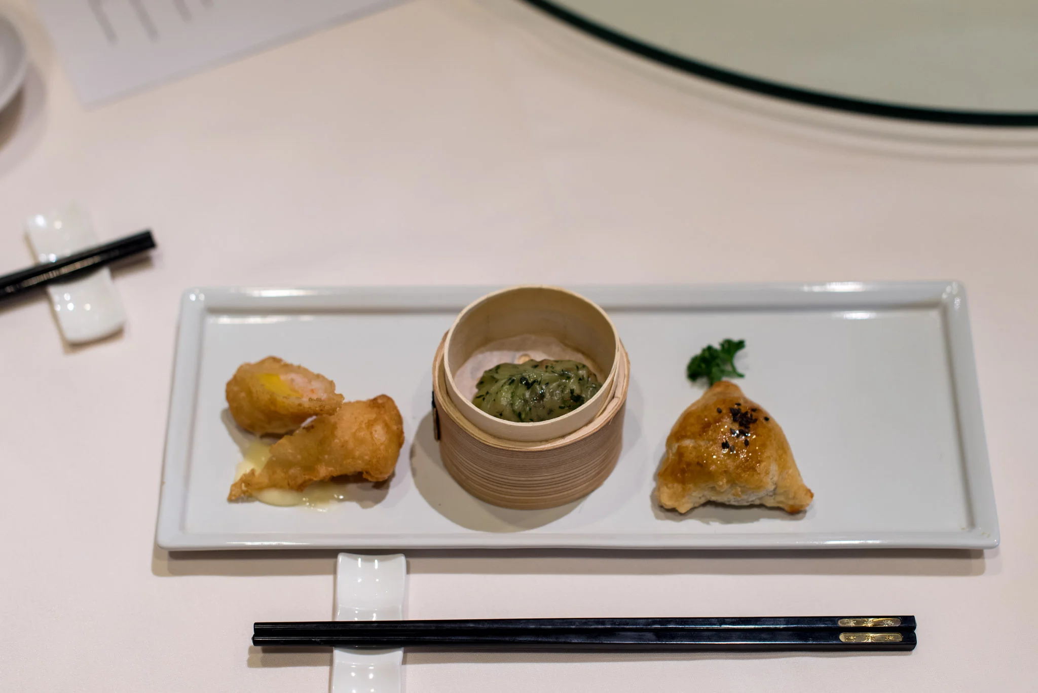 Deep-fried Mango Roll (S$5++ for two), Steamed Crystal Skin Vegetarian Dumpling (S$4++ for two), Baked Crispy Honey-Glazed Pork Puff with Black Pepper Sauce (S$5++ for two) Wan Hao - Singapore Marriott Tang Plaza Hotel