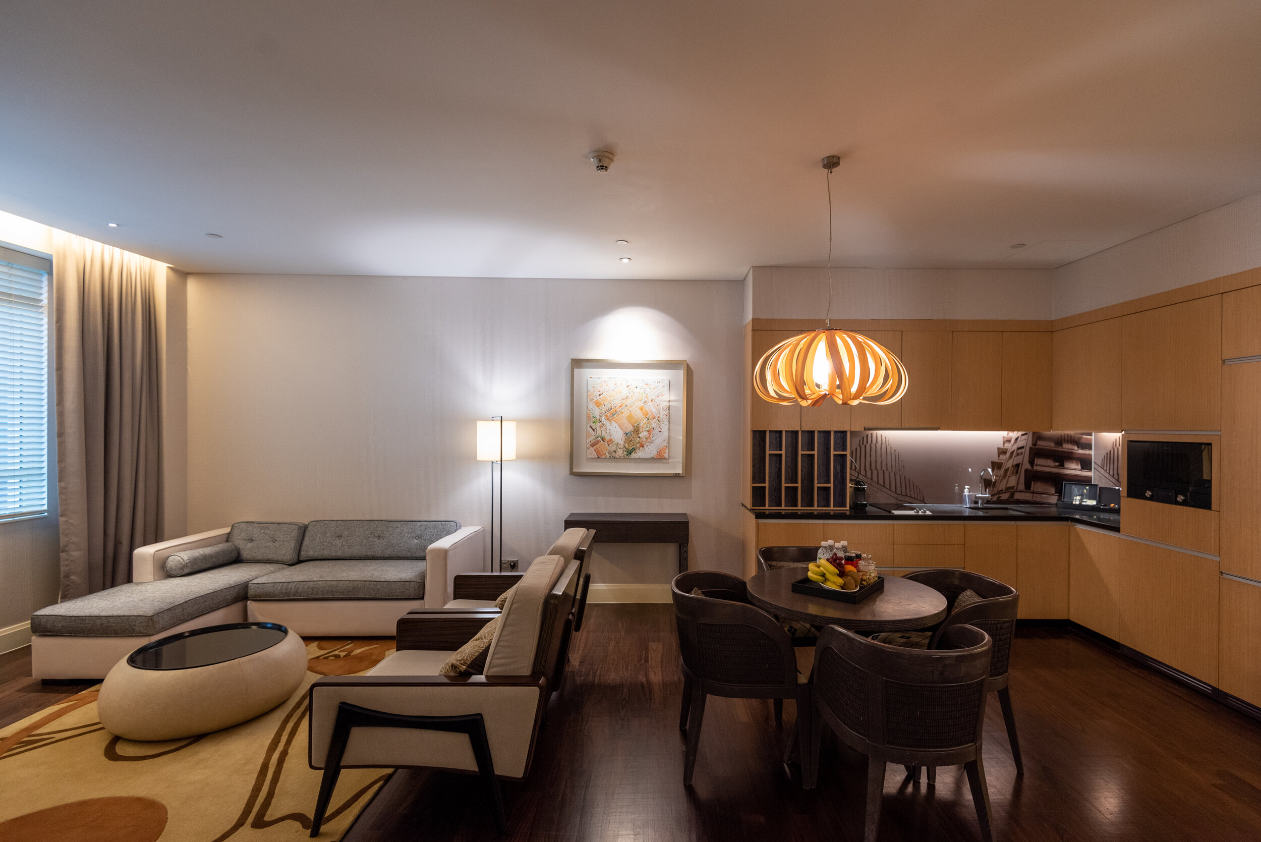 Living Area Brown Suite - Ascott Raffles Place Singapore