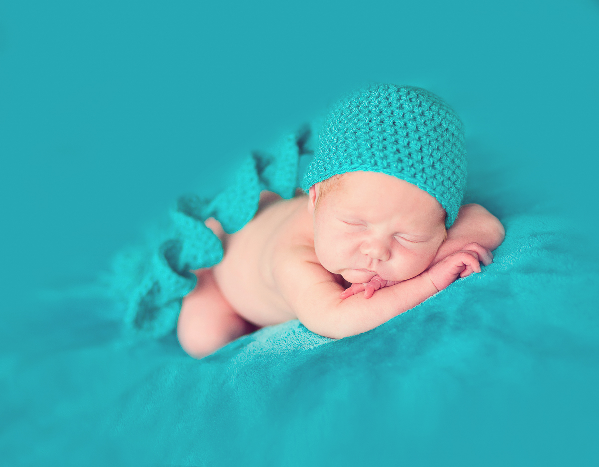 two week old baby in turquoise