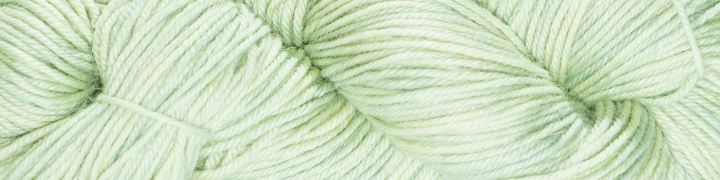 Winter Sky in Hennessy Aran (sometimes a bit more blue in reality) would show off these cables perfectly.