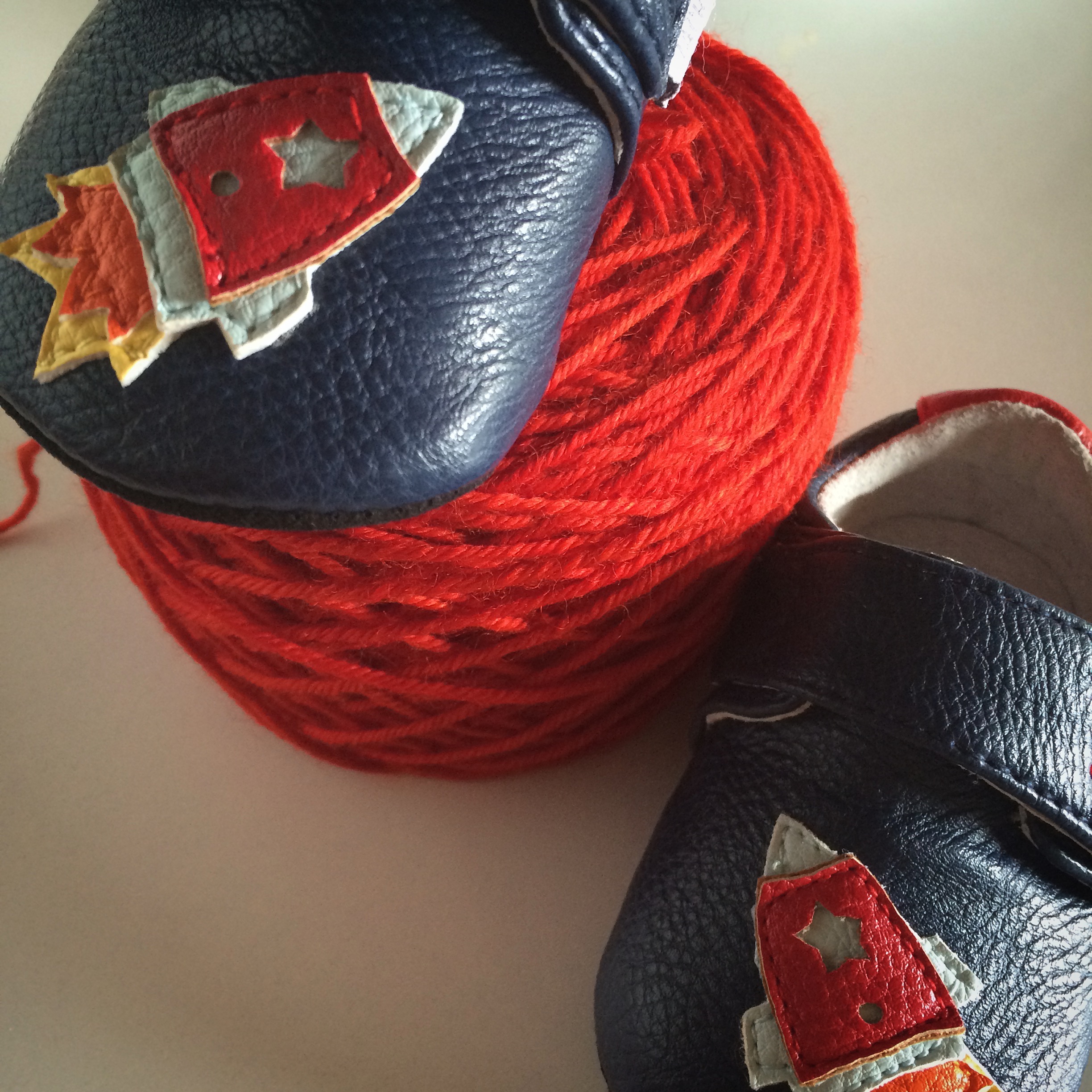 I picked up these rocket booties for our boy and a coordinating blanket this fiery red-orange is perfect. I couldn't help but call the project, "love you to the moon and back".