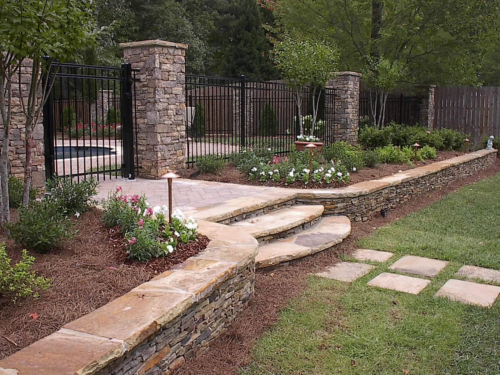 Willey Stacked Stone seat wall and columns.JPG