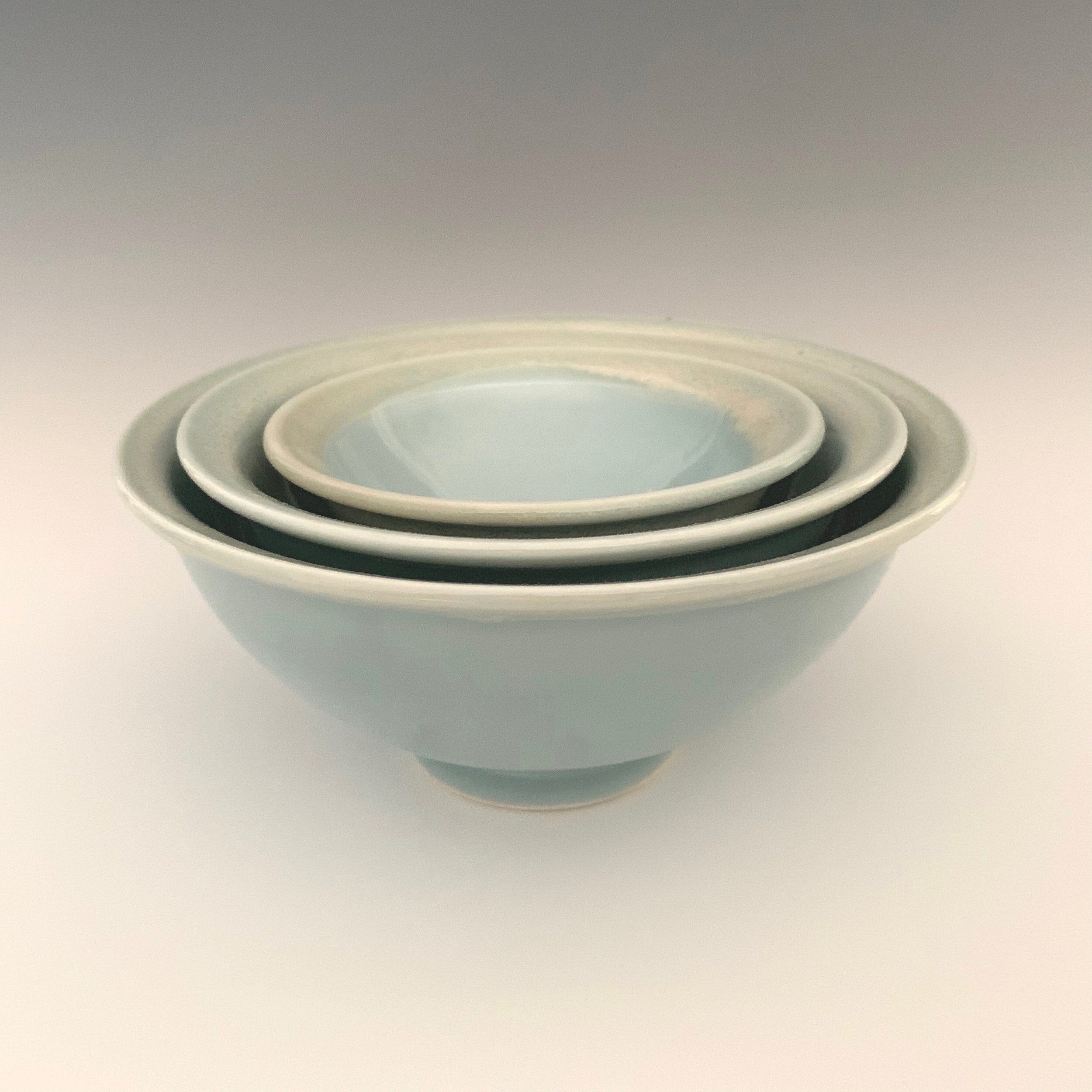 small porcelain nesting bowls with celadon glaze