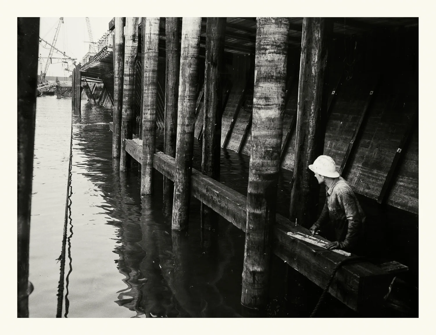 Photograph No.188. “Photograph of construction worker under the Boston Army Base Docks.” N.D.; US Army Corps of Engineers. Records of the Office of the Chief of Engineers, 1789-1999, RG 77; NARA Boston.