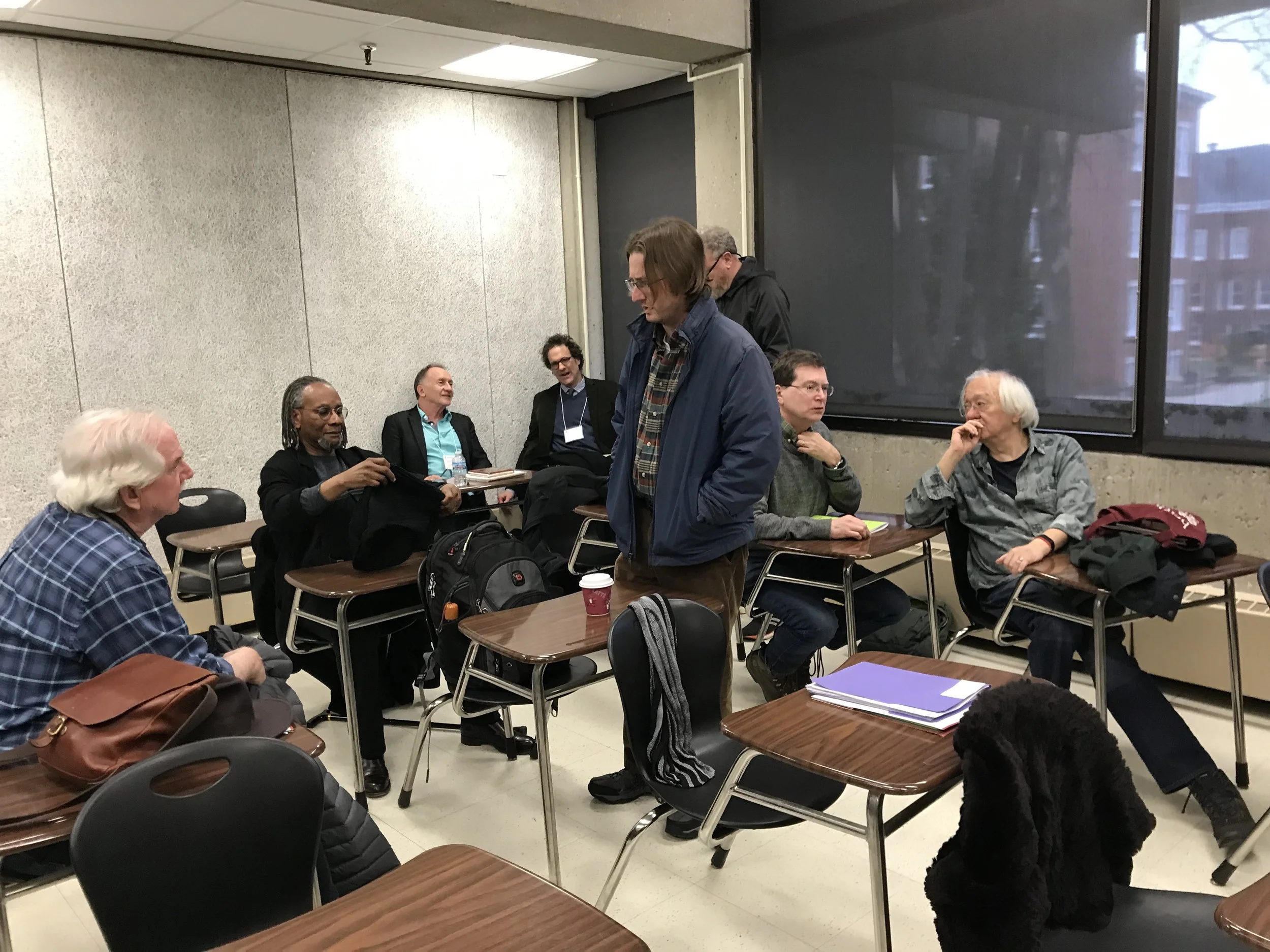 From left: unknown poet, Nathaniel Mackey, Alan Golding, Peter O’Leary, Joshua Hoeynck, Ken Taylor, Joseph Donahue, John Yau