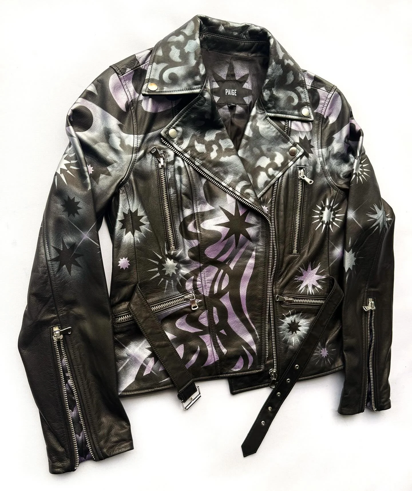 This is a recently commissioned Paige black leather women&rsquo;s motorcycle jacket, that features asymmetrical Baroque lavender patterning. Contact @erinbrammer to commission a garment. #custompaintedjacket