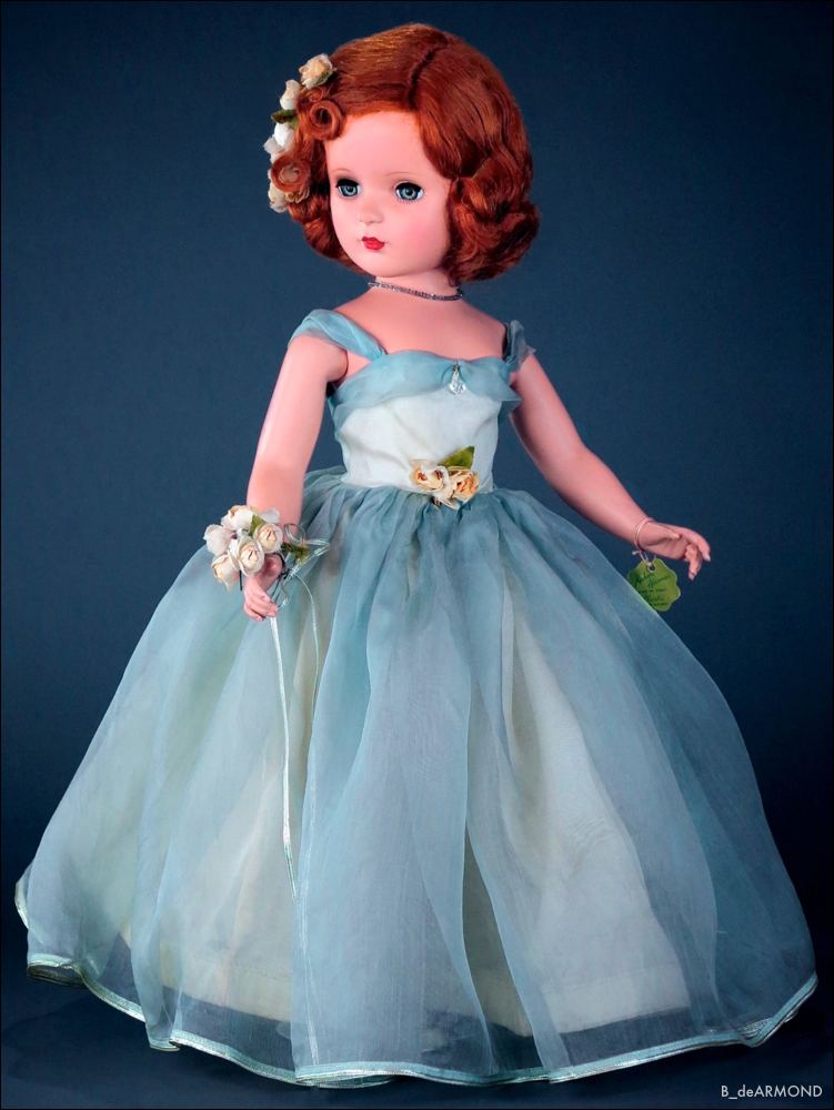 Available in a number of pastel colors and sizes, Princess Margaret Rose 1950, 21" early hard plastic in a blue organdy gown by the Alexander Doll Company. The doll features very soft pink accents of roses with metallic silver used in the gown, rose bouquet, beaded necklace and her shoes.