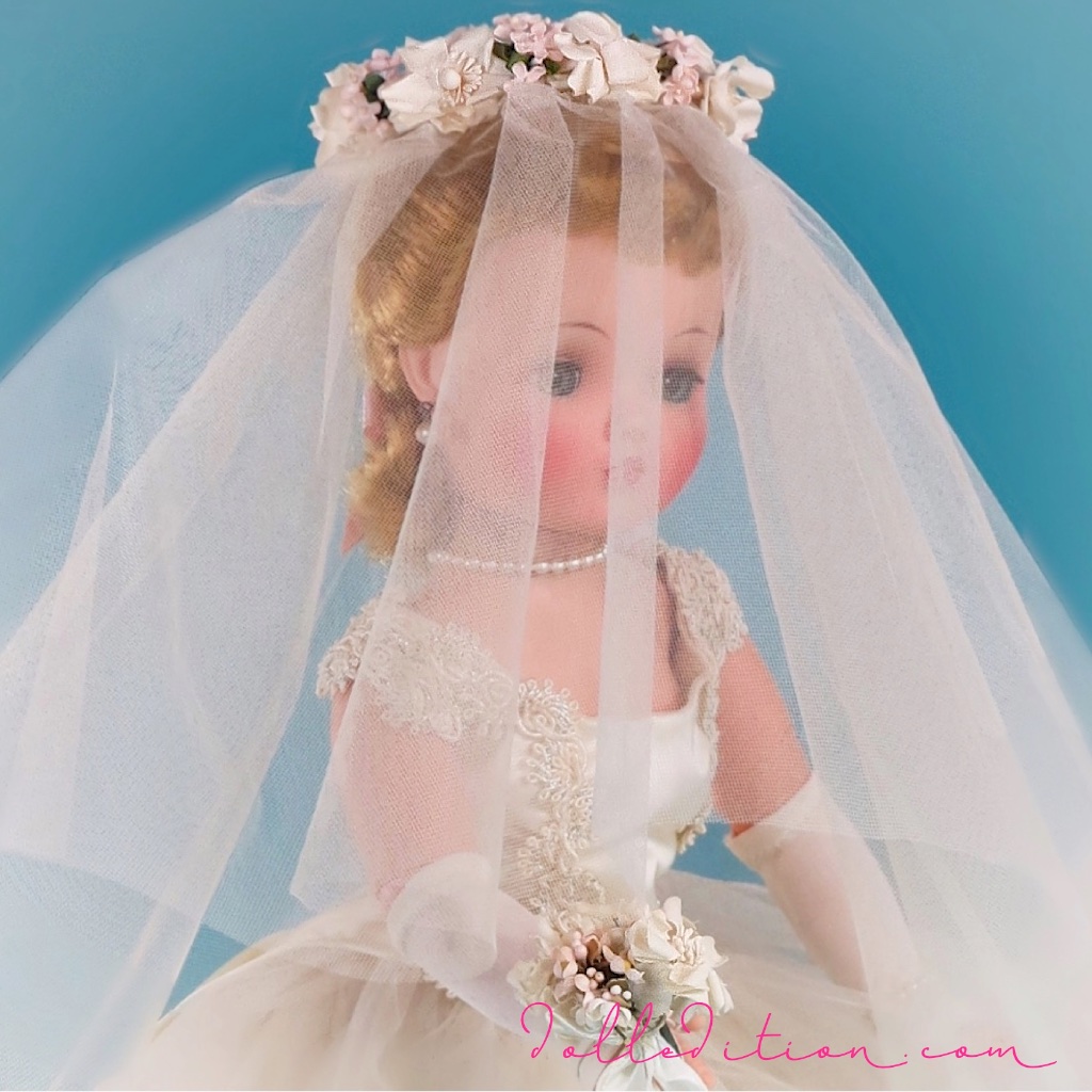 Cissy is wearing, what was called in the 1950s, a Chapel Length veil — shorter in the front and longer in the back. Now, it would be referred to as fingertip length.