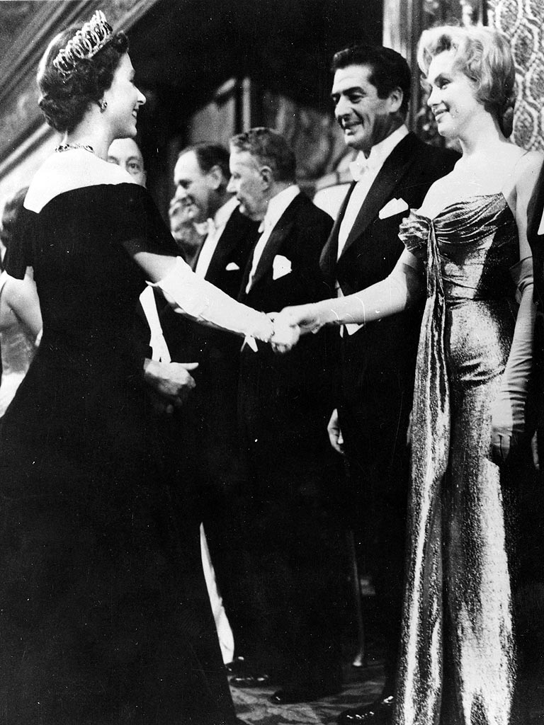 In this October 29, 1956 photo, Queen Elizabeth II meets Marilyn Monroe for the first time. Both 30, the two most famous women in the world have their paths cross at this moment.
