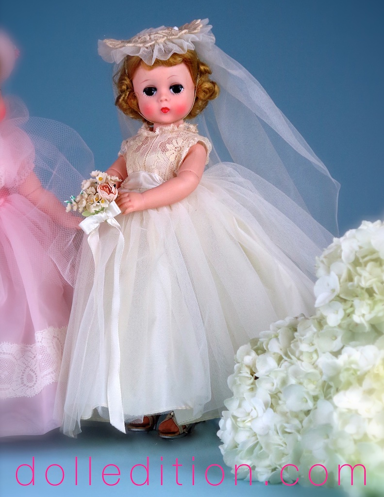 Lissy 1957 12" Bride No. 1160 - Dressed in a bridal ensemble of tulle, lace bodice and chapel length veil attached to a lace cap. Her bouquet is tied with satin ribbon.