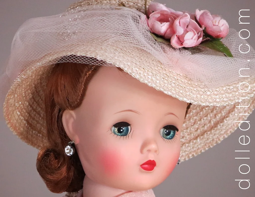 Cissy wears a major hat with this ensemble — a confection of Italian straw, pale pink tulle and roses. Not only does it frame her face, it takes the rest of her outfit to another level.