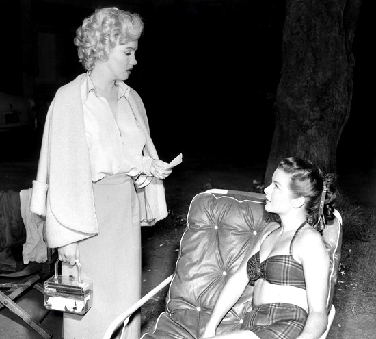 Marilyn Monroe with a lucite purse.