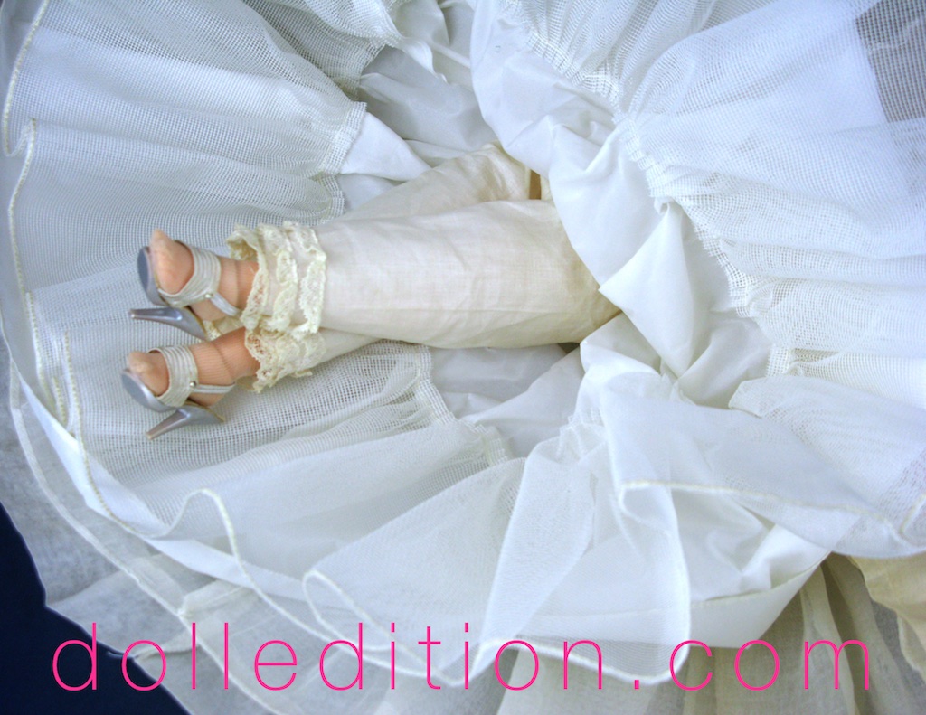 The Elise Scarlett No. 1740 has lace trimmed pantaloons and the newer style sling-back shoes that was being used at the time for both Elise and the last years of Cissy.
