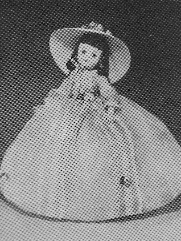 The 1963 Alexander Doll Company catalog shows their Elise Scarlett with the more familiar Elise mold. The black hair used on this doll is an interesting detail not often seen with the Alexander dolls. Elise has also grown by an inch this year. She now described as an 18" doll - up from the previous two years as a 17" doll. From 1957-1960 Elise is listed as a 16-1/2" doll.
