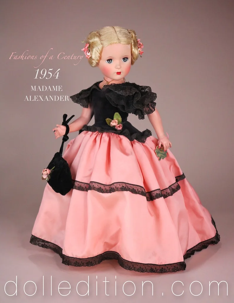 FASHIONS OF A CENTURY - 18 inch Lady, part of a nine doll series from 1954. These are among the rarest of Madame Alexander dolls. In Godey styled costuming, dressed in peach taffeta, black lace and velvet, the doll has a mesmerizing presence. One of her features is her elaborate coiled hairstyle. 