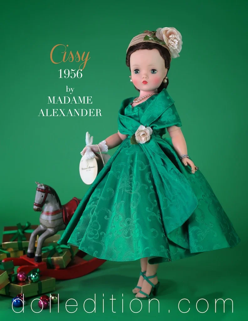 This green brocade 3/4 length dress with attached stole from 1956 is one of Madame Alexanders classics for Cissy. It also came in a more familiar red brocade version. Both had a white rose at the waist, and both lined in white taffeta.