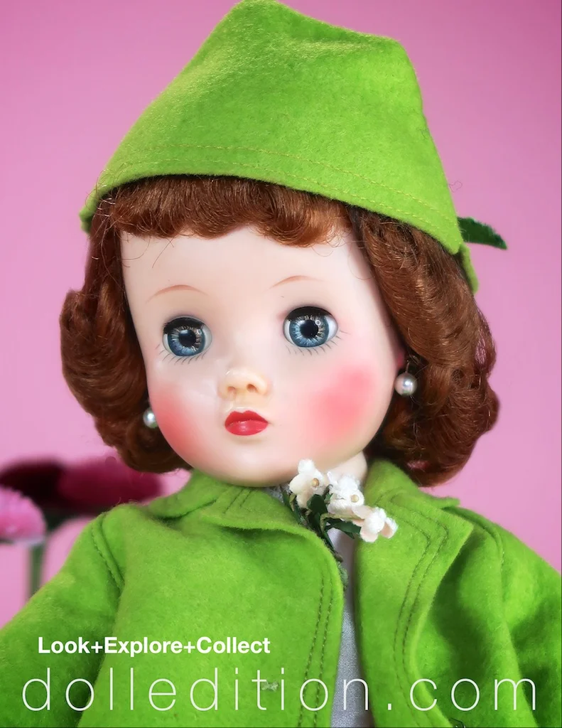 Details of Elise's spring swing coat are the double stitching and pale pink corsage accent. The back the hat for this ensemble is finished with a green velvet bow.